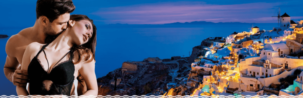 A couple embracing in the foreground with a scenic view of Santorini at dusk in the background.