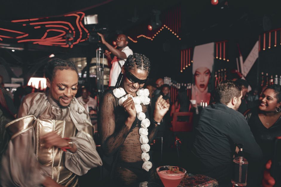 diverse group of adults at a cocktail party - Swinger party invites